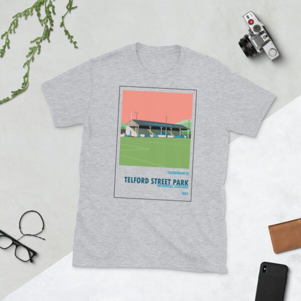 Light grey t-shirt of Caledonian FC and Telford Street Park