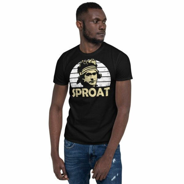 Man wearing a T-Shirt with Hugh "punk goalie" Sproat's silhouette graphic in front of a white sunburst design.