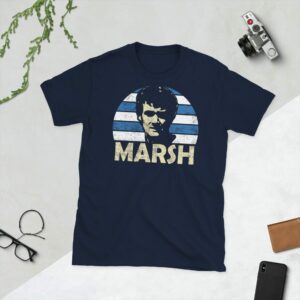 Navy Rodney Marsh QPR T-Shirt - A navy T-shirt with a QPR sunburst graphic and the word "MARSH" in blue and white stripes, paying tribute to QPR's iconic genius, Rodney Marsh.