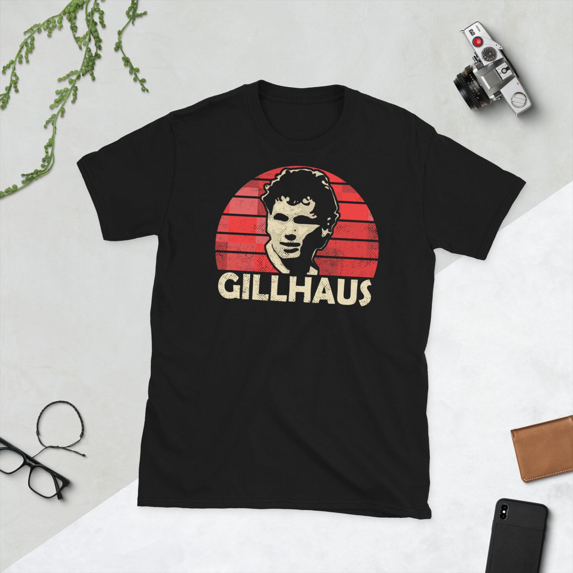 A black Hans Gillhaus Aberdeen FC t-shirt featuring a red sunburst design and the word "GILLHAUS" printed prominently in bold.