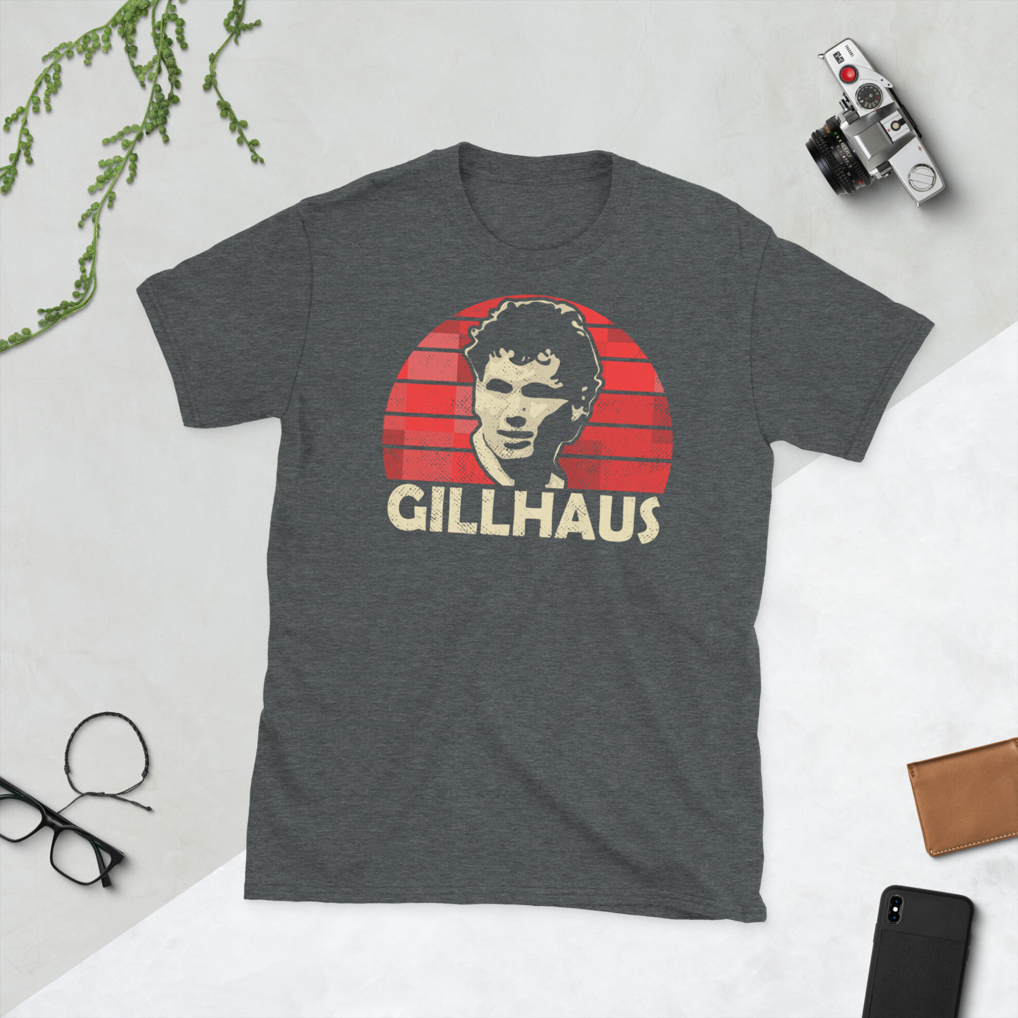 A heather grey Hans Gillhaus Aberdeen FC t-shirt featuring a red sunburst design and the word "GILLHAUS" printed prominently in bold.