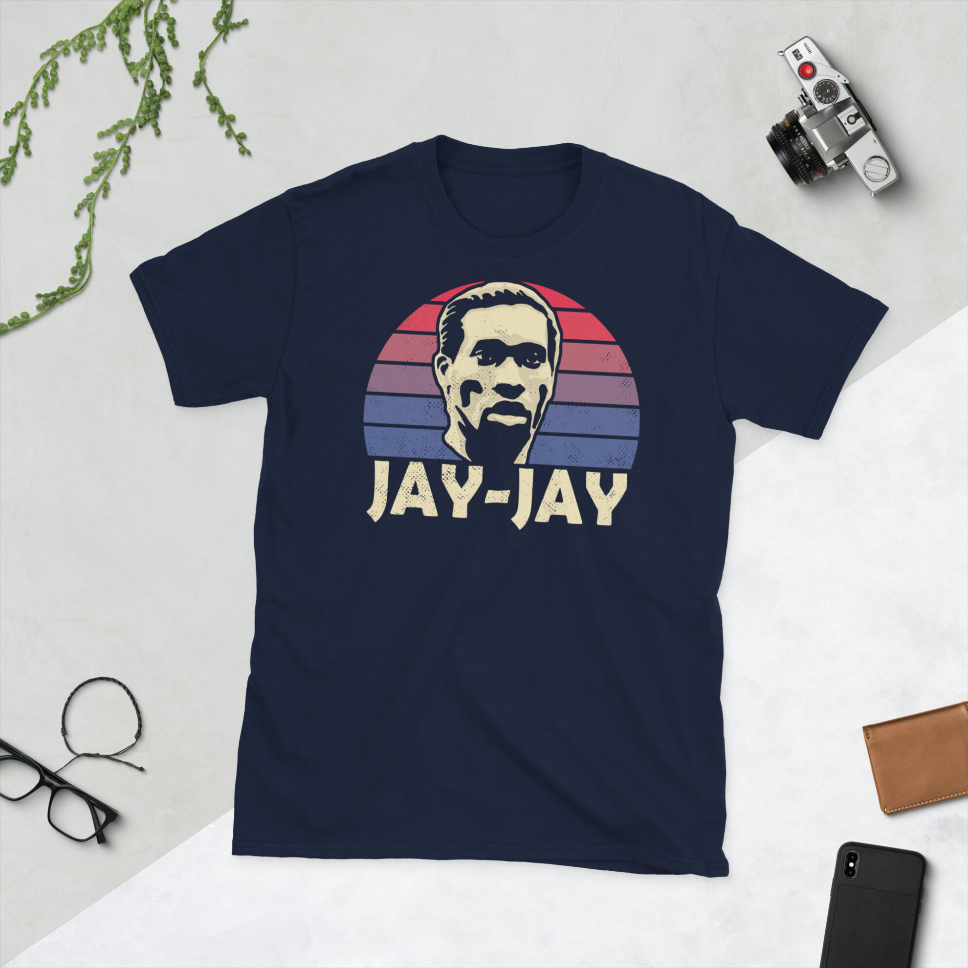 A navy Jay-Jay Okocha T-Shirt featuring a red and blue sunburst design (inspired by the Bolton Wanderers badge colours) and "JAY-JAY" printed prominently in bold.
