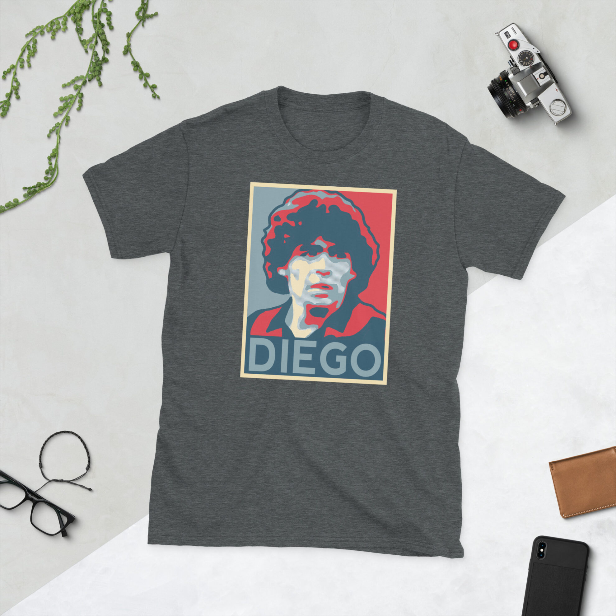 A heather grey Diego Maradona T-Shirt featuring a graphic portrait of Diego Maradona, similar to the Obama "HOPE" campaign poster, with "DIEGO" written below him in bold lettering.