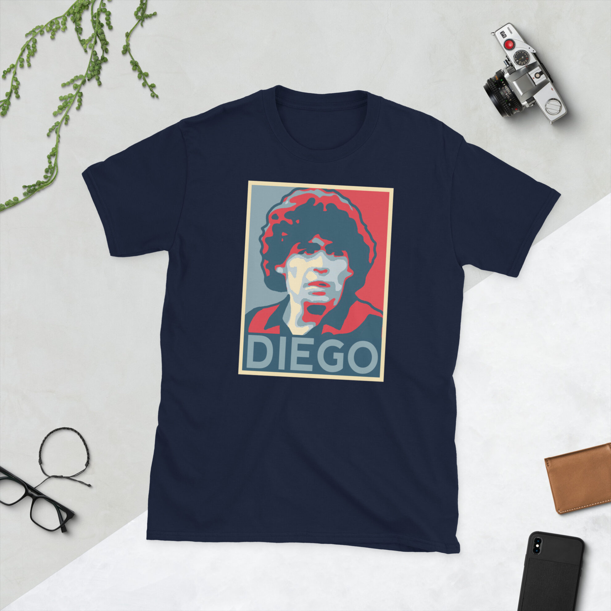A navy Diego Maradona T-Shirt featuring a graphic portrait of Diego Maradona, similar to the Obama "HOPE" campaign poster, with "DIEGO" written below him in bold lettering.