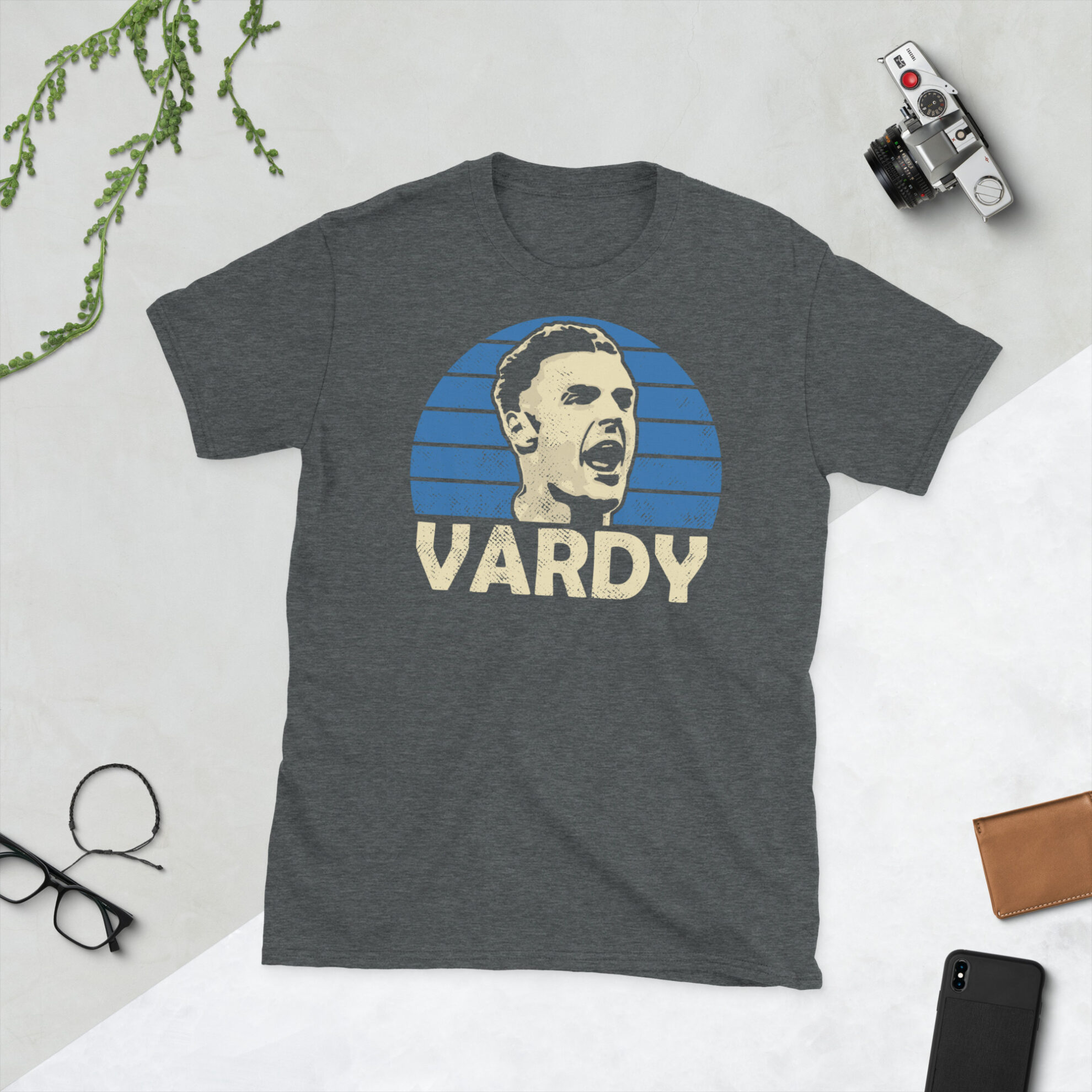 A heather grey Jamie Vardy T-Shirt featuring a blue sunburst design (inspired by Leicester City colours) and "VARDY" printed prominently in bold.