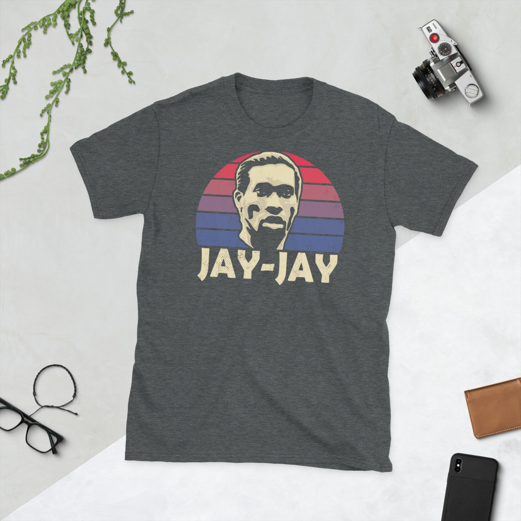 A heather grey Jay-Jay Okocha T-Shirt featuring a red and blue sunburst design (inspired by the Bolton Wanderers badge colours) and "JAY-JAY" printed prominently in bold.