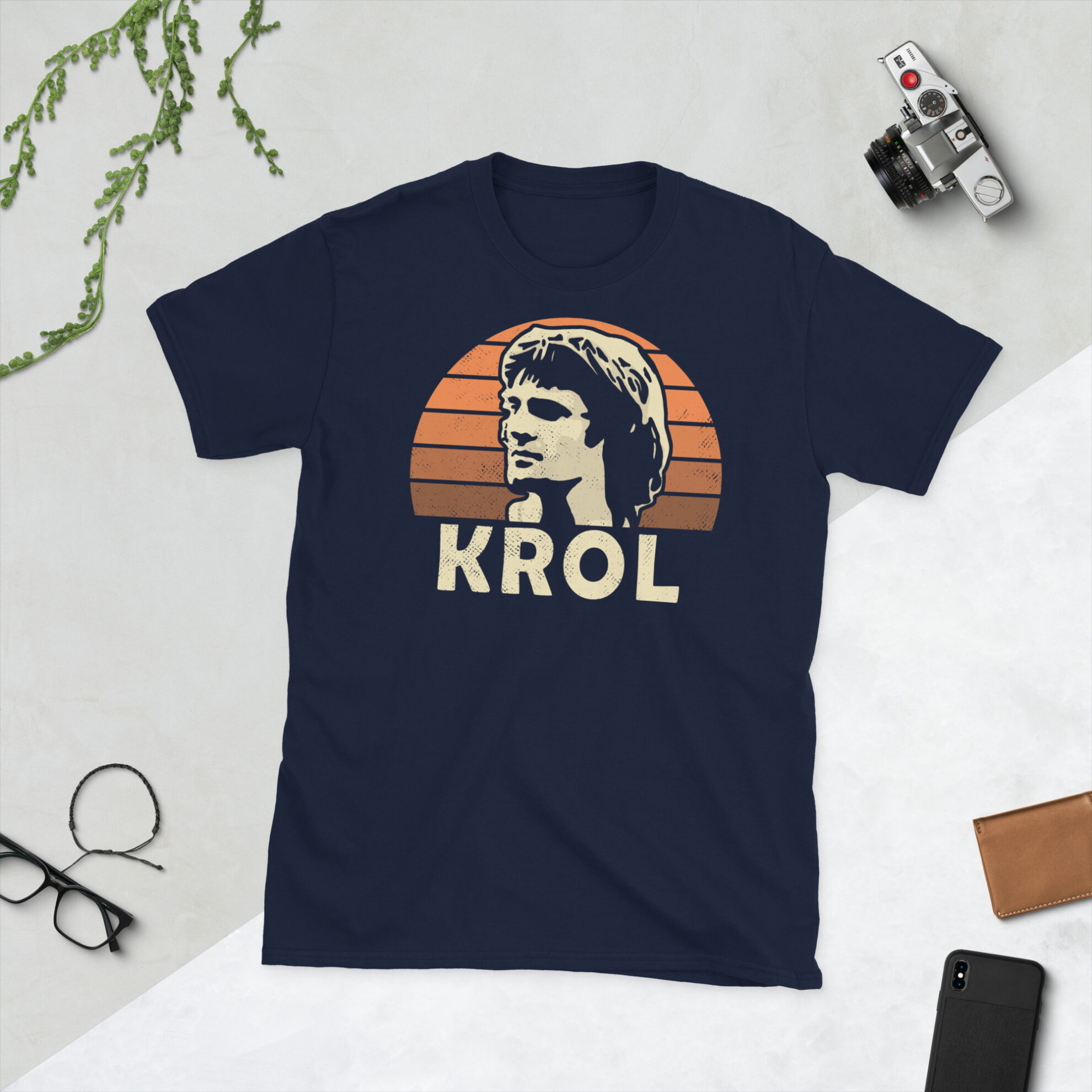 A navy Ruud Krol T-Shirt featuring an orange sunburst design (inspired by the Netherlands national team colours) and "KROL" printed prominently in bold.