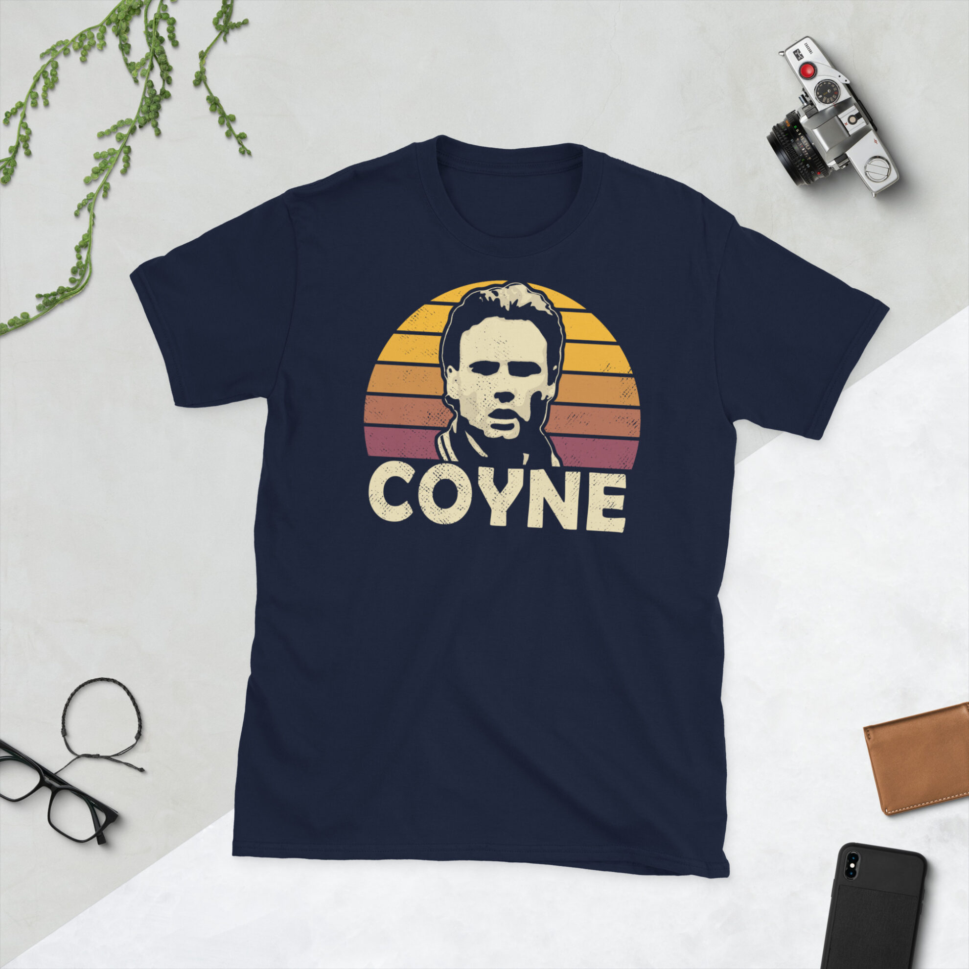 A navy Tommy Coyne T-Shirt featuring a claret and amber sunburst design (Motherwell colours) and "COYNE" printed prominently in bold.