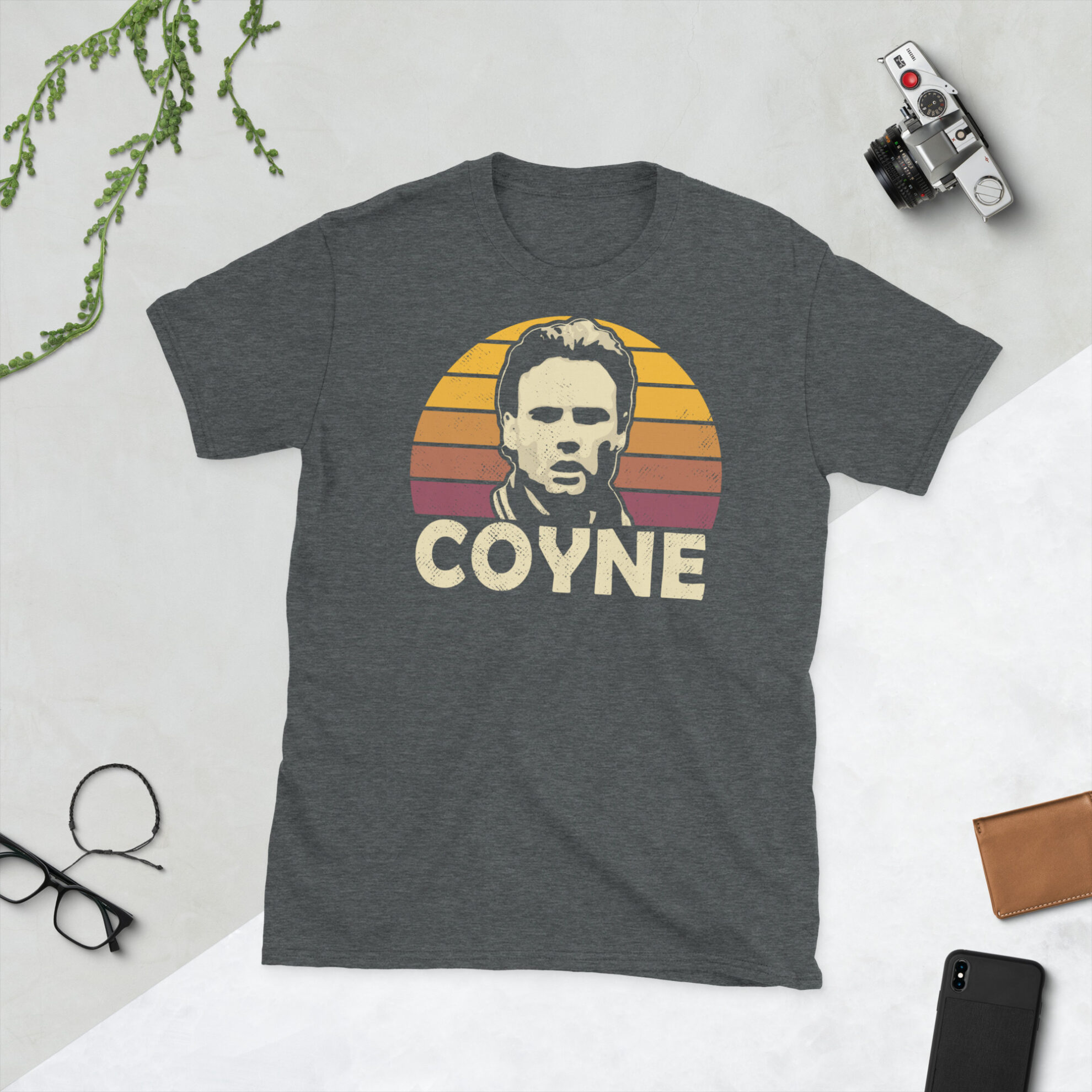 A heather grey Tommy Coyne T-Shirt featuring a claret and amber sunburst design (Motherwell colours) and "COYNE" printed prominently in bold.
