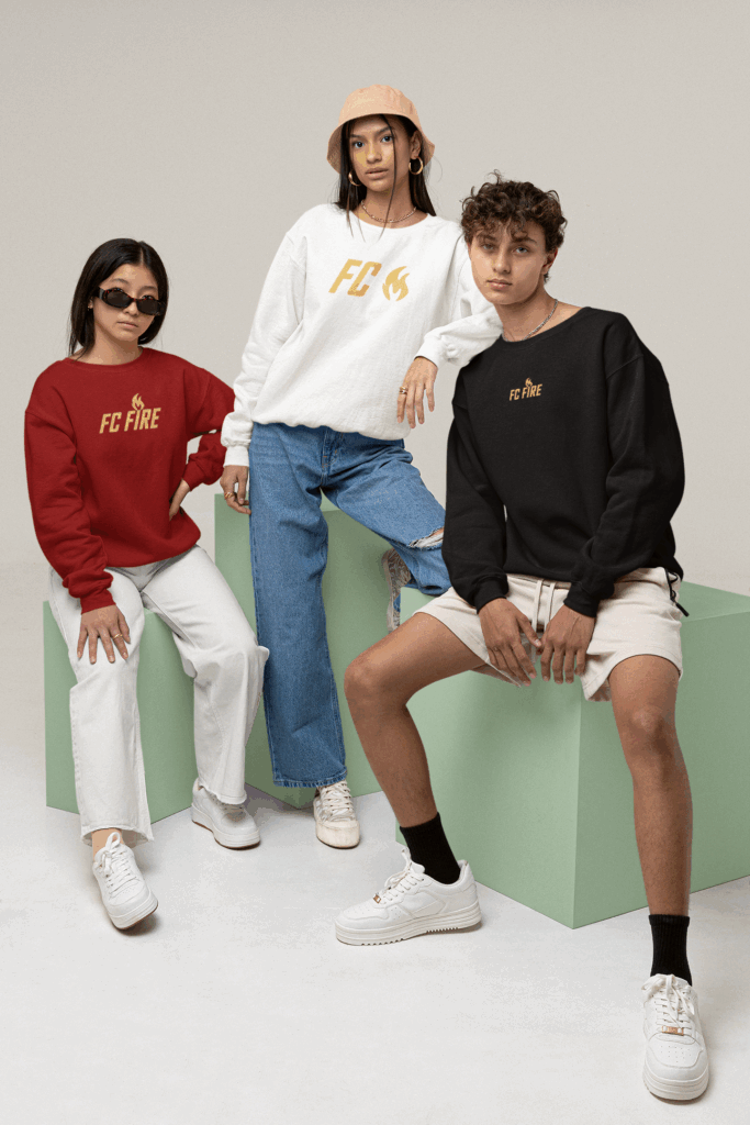 Three stylish teens in FC Fire’s color-blocked t-shirts and sweatshirts – premium football streetwear from Enfield, UK