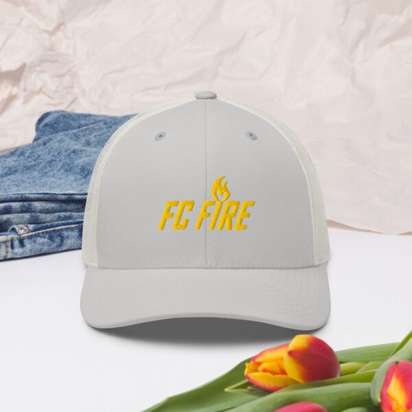 A silver FC Fire retro trucker hat with gold embroidered logo – adjustable football cap