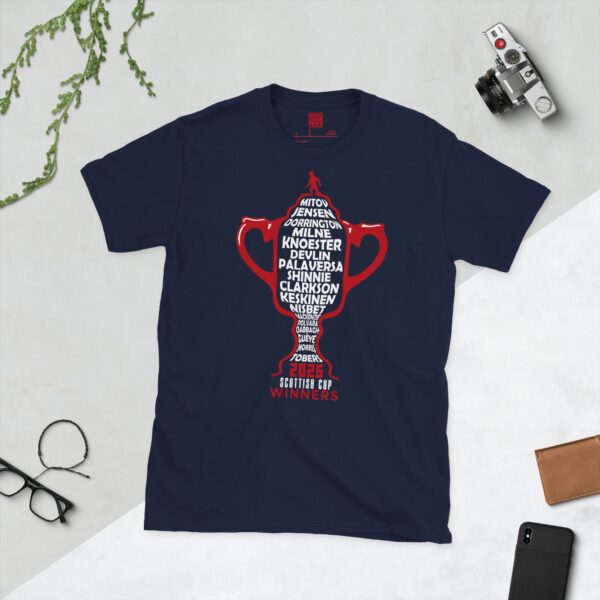 A navy blue T-shirt featuring a red outline of the Scottish Cup, with white text listing the names of every Aberdeen player from the 2025 Scottish Cup winning team, and "2025 SCOTTISH CUP WINNERS" below.
