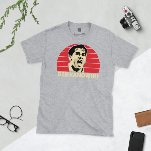 A sports grey Dariusz Dziekanowski T-shirt featuring a red sunburst design with "DZIEKANOWSKI" written under the main graphic.