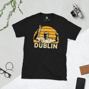 A black Dion Dublin T-shirt featuring a yellow sunburst design with "DUBLIN" written under the main graphic.