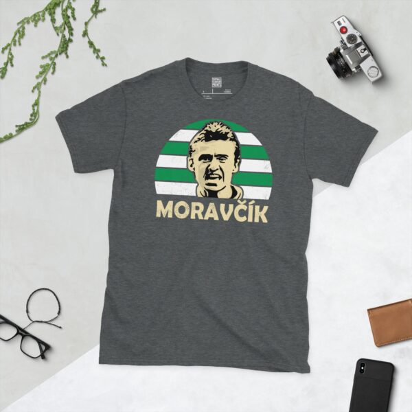 A dark heather Lubo Moravcik T-shirt featuring a green and white striped sunburst design with "MORAVCIK" written under the main graphic.