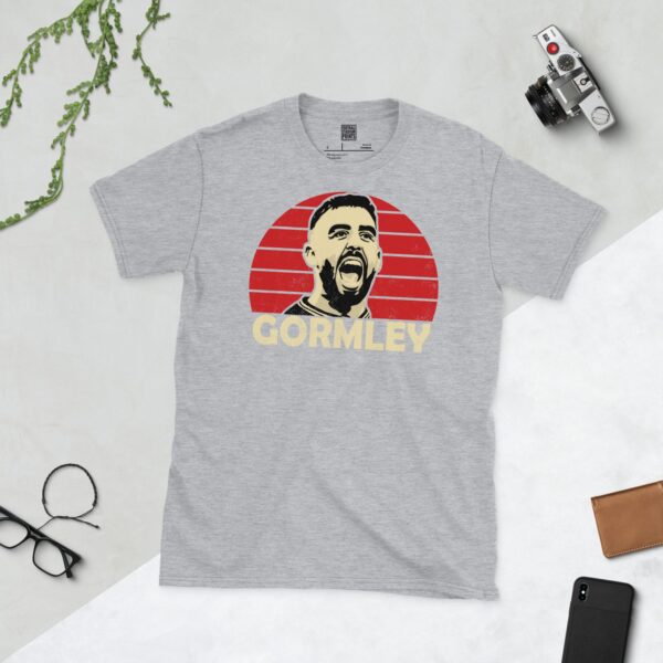 A sports grey Joe Gormley T-shirt featuring a red sunburst design with "GORMLEY" written under the main graphic.