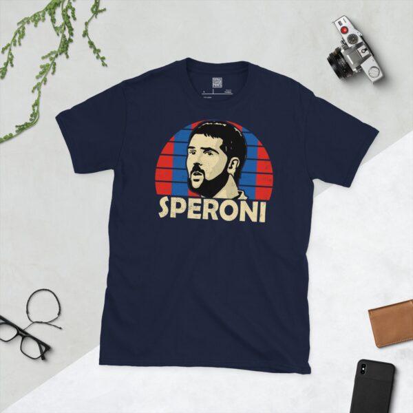 Celebrate Crystal Palace legend Julian Speroni with this navy blue tee. It features a striking blue and red striped sunburst design with "SPERONI" written under the main graphic.