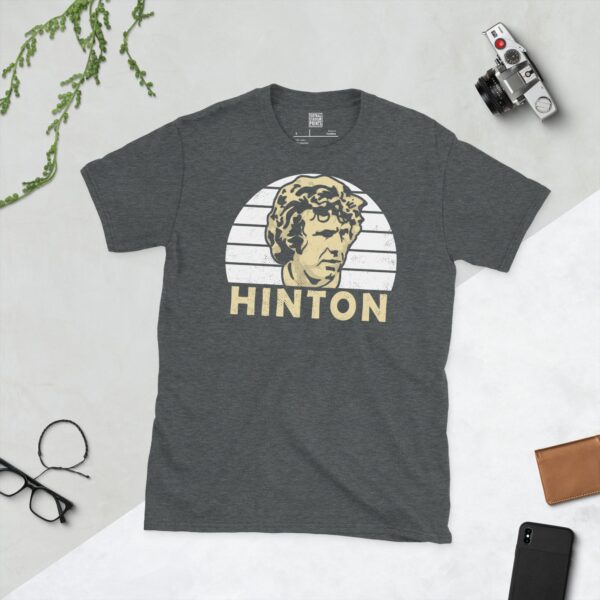 A dark heather Alan Hinton T-shirt featuring a white sunburst design with "HINTON" written under the main graphic.
