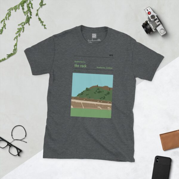 A subtle dark heather T-shirt emblazoned with a scenic depiction of Dumbarton Rock looming above a football ground. The graphic commemorates Dumbarton FC, known as 'The Sons', and their historic origins.