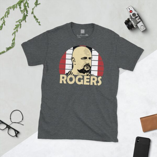 A dark heather Scott Rogers T-shirt featuring a red, white, and black sunburst design with "ROGERS" written under the main graphic.