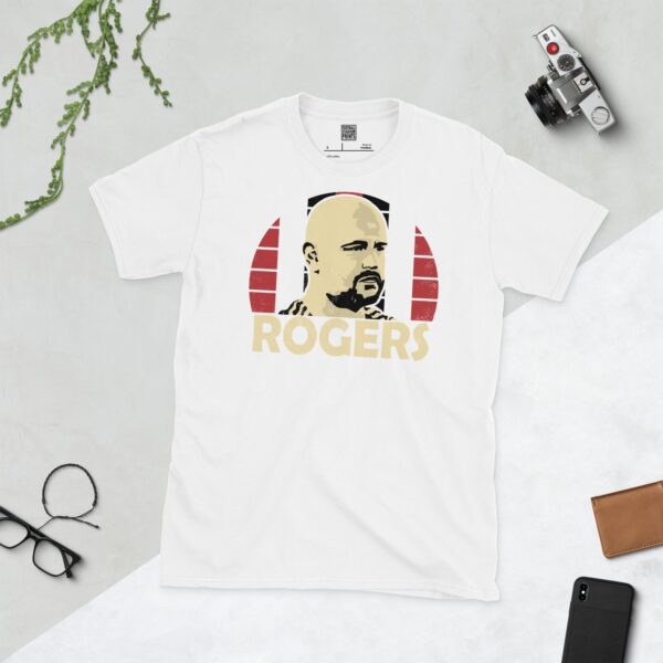 A white Scott Rogers T-shirt featuring a red, white, and black sunburst design with "ROGERS" written under the main graphic.