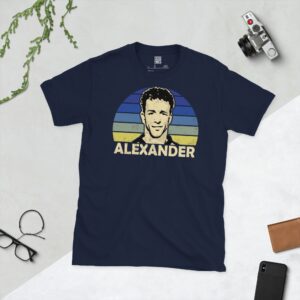 Celebrate Greenock Morton legend Rowan Alexander with this navy blue tee. It features a striking blue fading to yellow sunburst design with "ALEXANDER" written under the main graphic.
