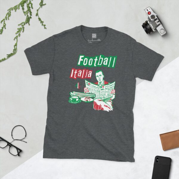 A dark heather T-shirt featuring a green, white, and red graphic of James Richardson sat at a cafe table reading La Gazzetta Dello Sport, in tribute to Channel 4's Football Italia.