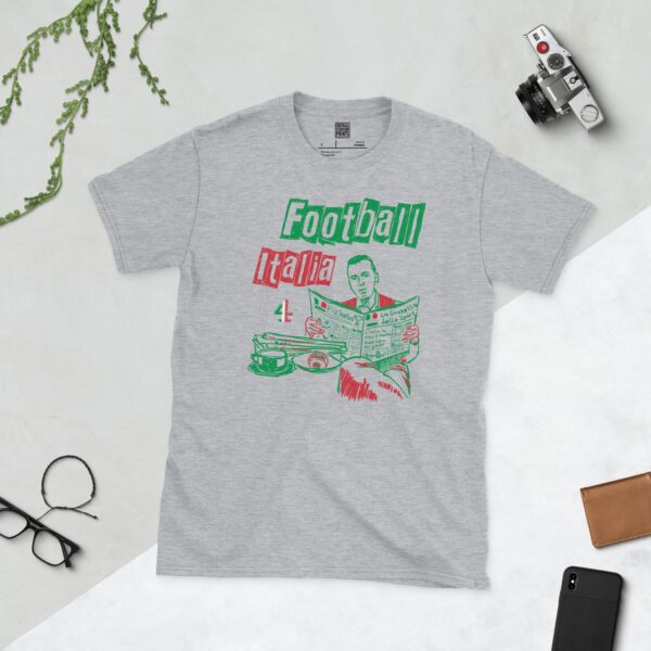 A sports grey T-shirt featuring a green, white, and red graphic of James Richardson sat at a cafe table reading La Gazzetta Dello Sport, in tribute to Channel 4's Football Italia.