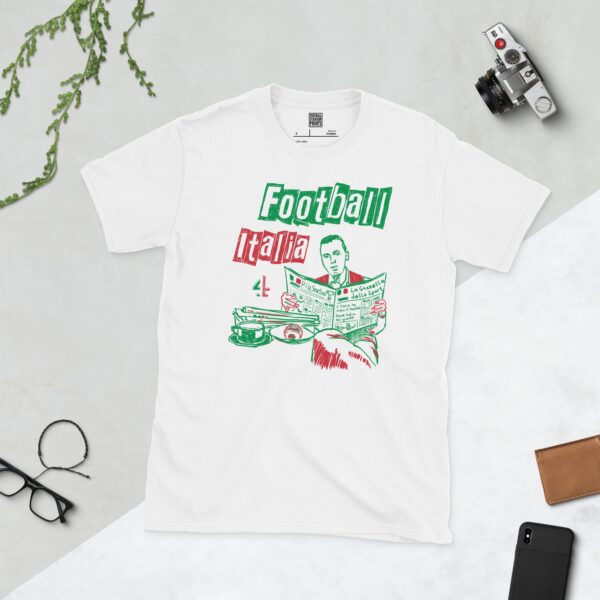 A white T-shirt featuring a green, white, and red graphic of James Richardson sat at a cafe table reading La Gazzetta Dello Sport, in tribute to Channel 4's Football Italia.