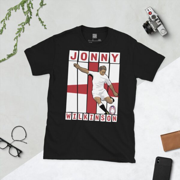 A black T-shirt featuring a graphic of England rugby legend Jonny Wilkinson in his distinctive pose, taking a kick.