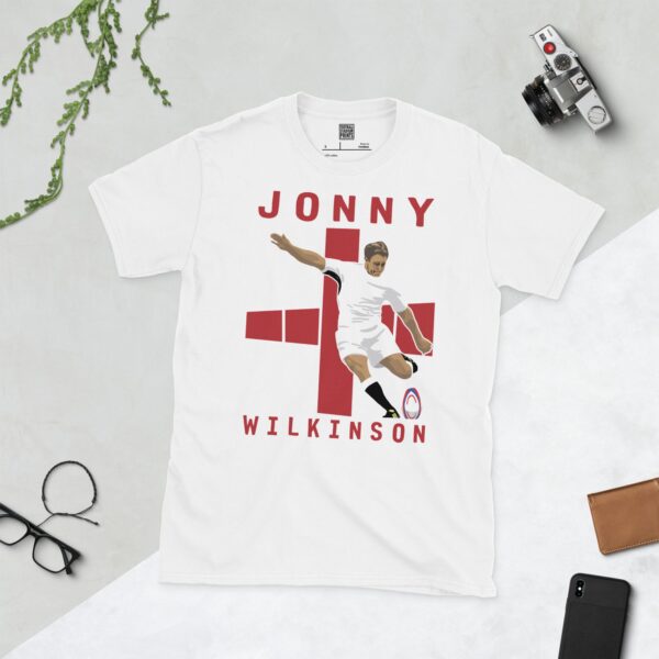 A white T-shirt featuring a graphic of England rugby legend Jonny Wilkinson in his distinctive pose, taking a kick.
