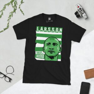 A bold black T-shirt displaying a vibrant illustration of Celtic icon Henrik Larsson's face. Behind him are classic green and white horizontal stripes, with his surname "LARSSON" and the title "KING OF KINGS" prominently featured in block letters.