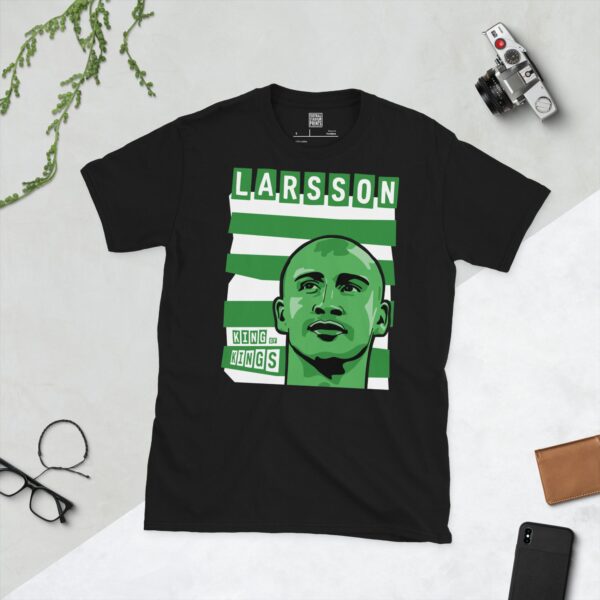 A bold black T-shirt displaying a vibrant illustration of Celtic icon Henrik Larsson's face. Behind him are classic green and white horizontal stripes, with his surname "LARSSON" and the title "KING OF KINGS" prominently featured in block letters.