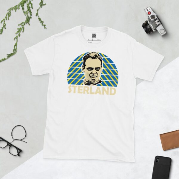 A crisp white T-shirt featuring a graphic of Mel Sterland's face. Behind him is a radiating sunburst in blue and yellow, typical of the Leeds United badge, with his surname "STERLAND" prominently displayed below.