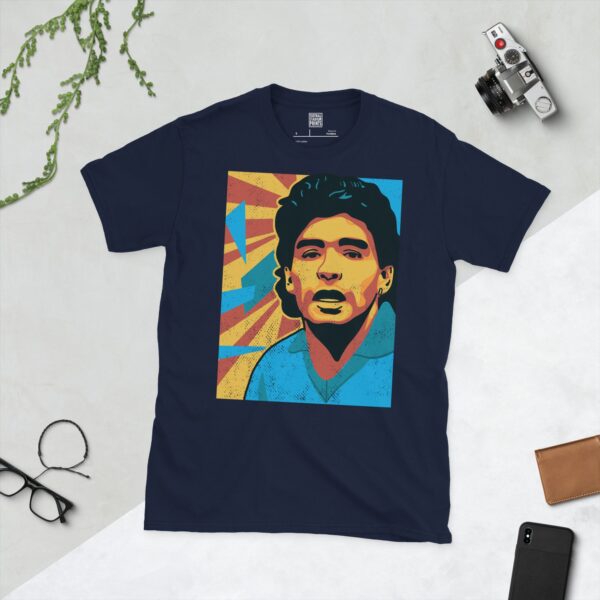 A navy blue T-shirt featuring a colourful, distressed graphic of Diego Maradona with a blue shirt and yellow and red background elements.