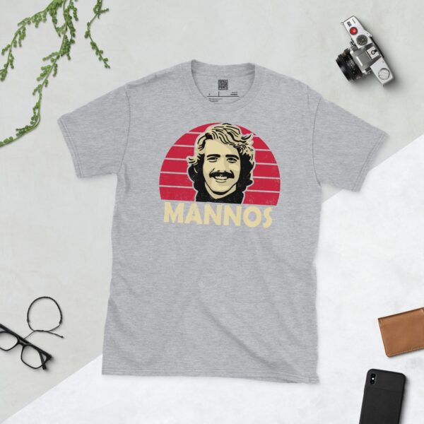 A sports grey Peter Mannos T-shirt featuring a Cardinal red sunburst design with "MANNOS" written under the main graphic.