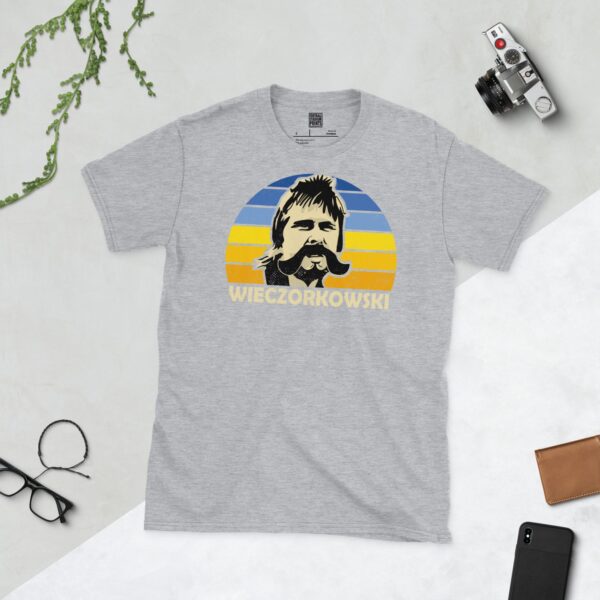 A sports grey Gert Wieczorkowski T-shirt featuring a blue and yellow sunburst design with "WIECZORKOWSKI" written under the main graphic.