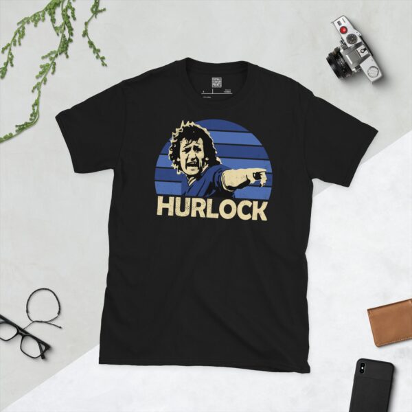 A black Terry Hurlock T-shirt featuring a blue sunburst design with "HURLOCK" written under the main graphic.