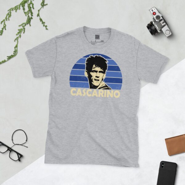 A sports grey Tony Cascarino T-shirt featuring a blue sunburst design with "CASCARINO" written under the main graphic.