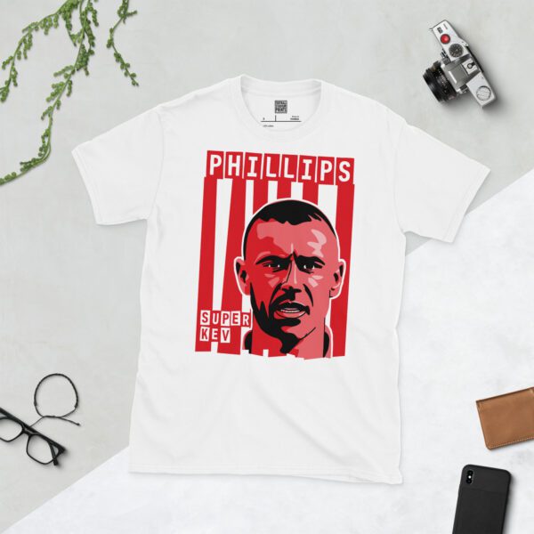 A clean white T-shirt featuring a dynamic graphic of Sunderland legend Kevin Phillips's face, set against a background of bold red and white vertical stripes. His surname "PHILLIPS" is prominently displayed above, with "SUPER KEV" clearly visible below the portrait.