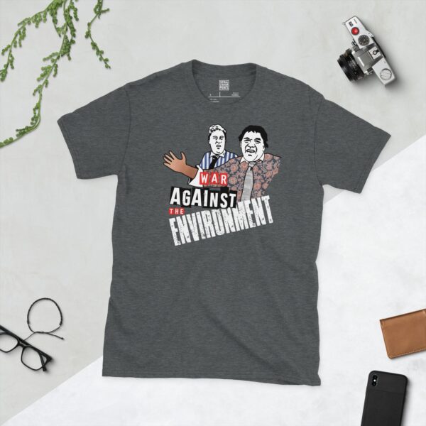 A dark heather t-shirt featuring a graphic of Vic Reeves and Bob Mortimer as their "Free Runners" characters, with the slogan "WAR AGAINST THE ENVIRONMENT" in bold white text.