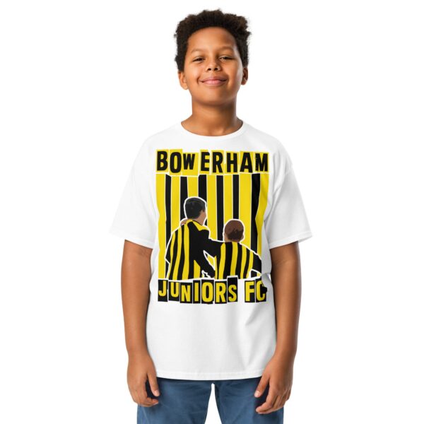 A clean white youth T-shirt featuring a stylised graphic of two young boys in black and yellow striped tops with "BOWERHAM" and "JUNIORS FC" text on the front.
