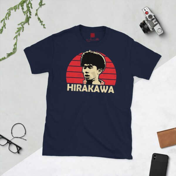 A deep navy blue T-shirt featuring a compelling graphic of Yu Hirakawa, the former Bristol City player, with his image set against a vivid red sunburst design. His iconic surname "HIRAKAWA" is clearly visible, paying tribute to his time at the club.