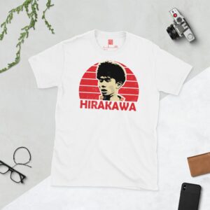 A clean white T-shirt featuring a stylised graphic of Bristol City player Yu Hirakawa's face, set against a vibrant red sunburst background. His surname "HIRAKAWA" is prominently displayed below the portrait.