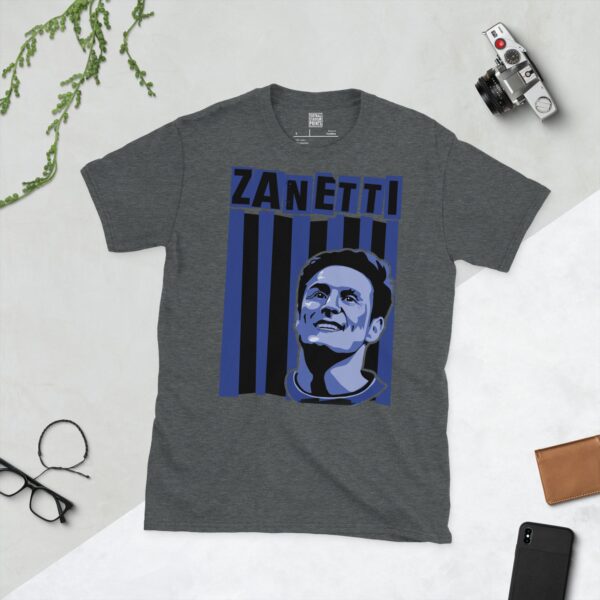A subtle dark heather T-shirt displaying a distinctive graphic of former Inter Milan maestro Javier Zanetti. His portrait is captured against a retro black and blue striped backdrop, with his surname "ZANETTI" directly above the illustration.