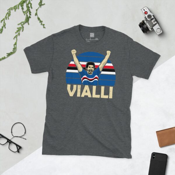 A subtle dark heather T-shirt displaying a distinctive graphic of former Sampdoria goal machine Gianluca Vialli. His celebratory pose is captured against a retro striped background, with his surname "VIALLI" directly beneath the illustration.