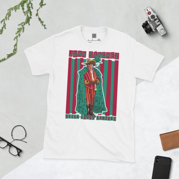 A clean white T-shirt featuring a stylized graphic of Sean Connery as Juan Sanchez Villa-Lobos Ramírez from the film Highlander, dressed in his flamboyant outfit with a peacock cape, against a background of red and green vertical stripes. His full name is displayed above and below the portrait.