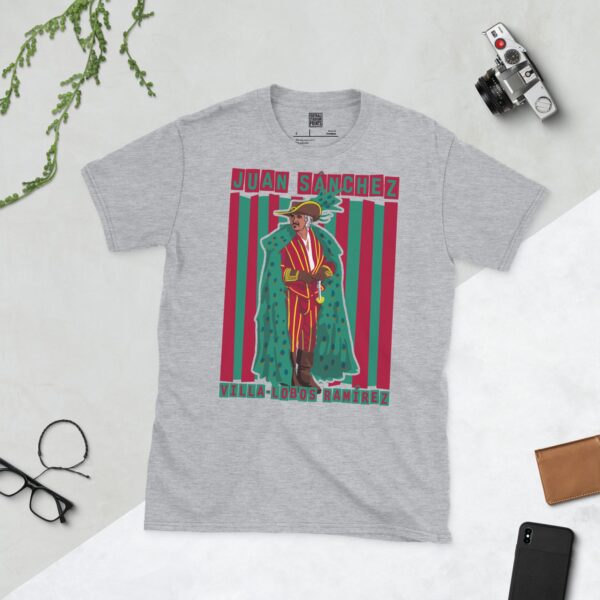 A versatile sports grey T-shirt showcasing a dynamic illustration of Juan Sanchez Villa-Lobos Ramírez, the iconic character from Highlander. The design includes his full figure over a bold red and green striped pattern, with his name clearly visible.