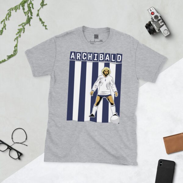 A versatile sports grey T-shirt showcasing a dynamic illustration of Steve Archibald, the beloved Tottenham Hotspur striker. The design includes his full figure over a vibrant navy and white striped pattern, typical of the club's colours, with "ARCHIBALD" clearly visible above.