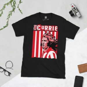 A bold black T-shirt emblazoned with a striking portrait of Sheffield United icon Tony Currie. The graphic depicts his face against a backdrop of red and white stripes, and his name is a central feature.